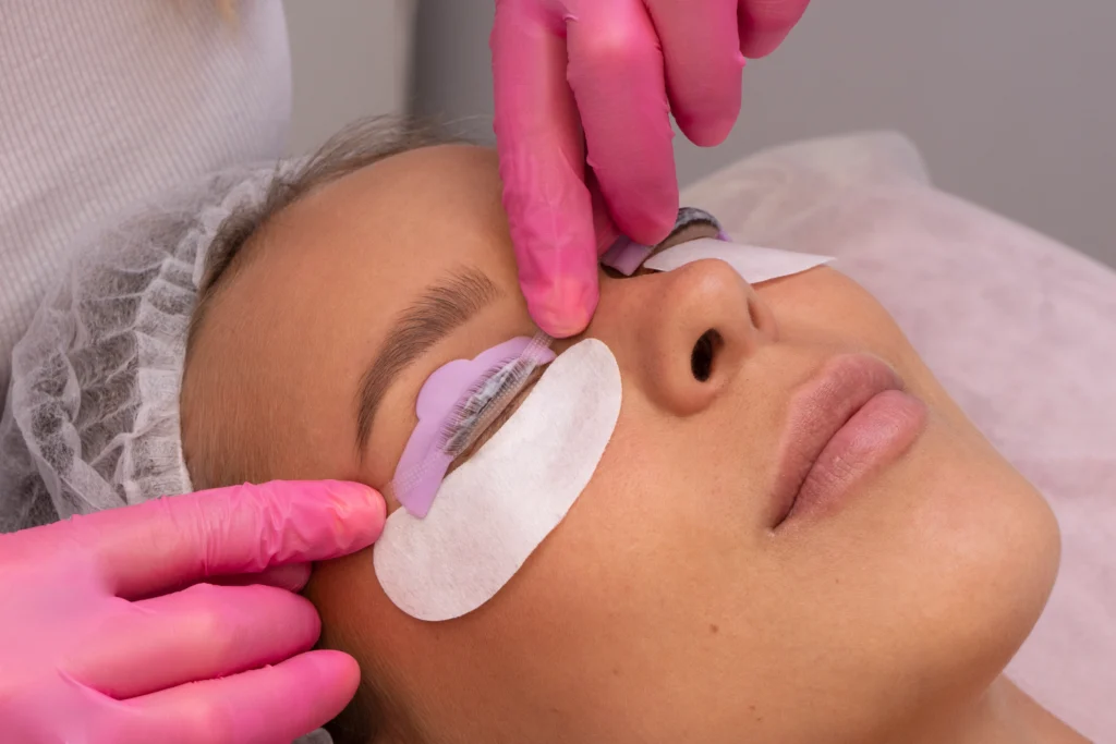 The image shows a client undergoing a lash lift procedure, Lash Lift Prices