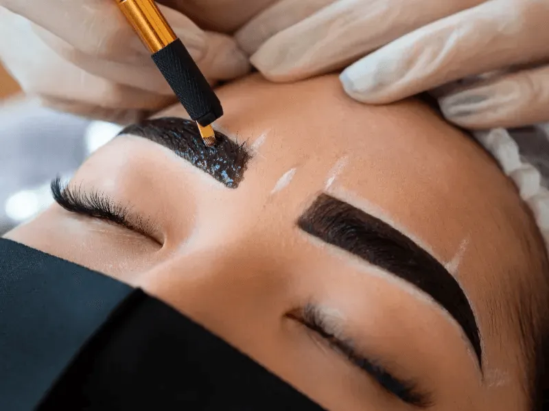 Close-up of precise eyebrow tattooing, highlighting India's growing trend for well-defined brows.