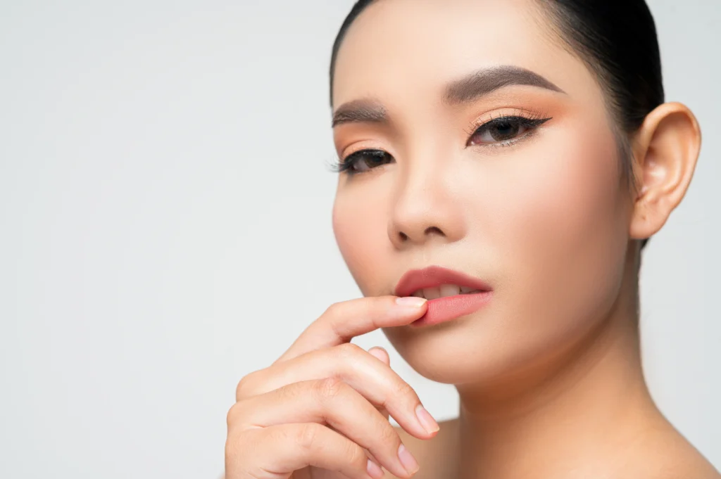 An image for a confident lady showing her lips after getting lip blush treatment